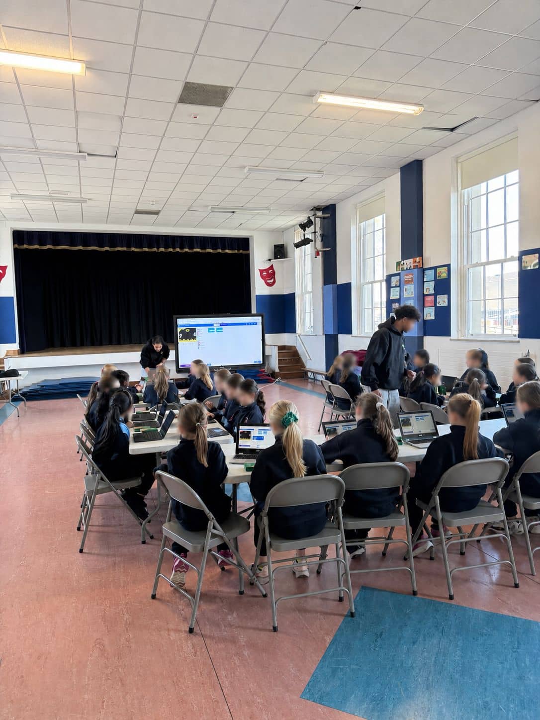 Children coding with Micro:bits and laptops at an after-school club